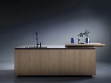 Euromobil's Antis Project 10 Design Kitchen with a natural sandblasted oak island and stainless steel countertop.