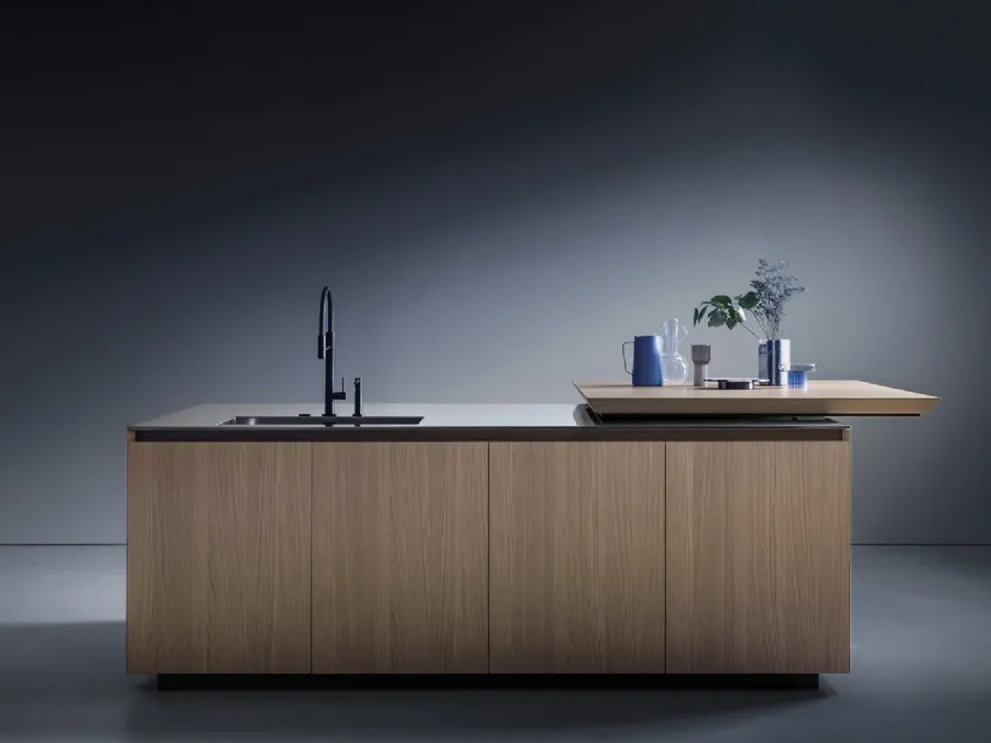 Euromobil's Antis Project 10 Design Kitchen with a natural sandblasted oak island and stainless steel countertop.