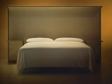 Courtoisie bed with wooden headboard and Bolzan Letti fabric.