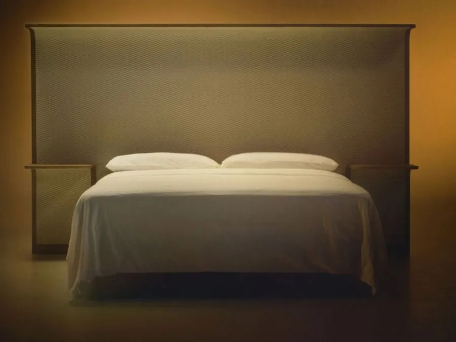 Courtoisie bed with wooden headboard and Bolzan Letti fabric.