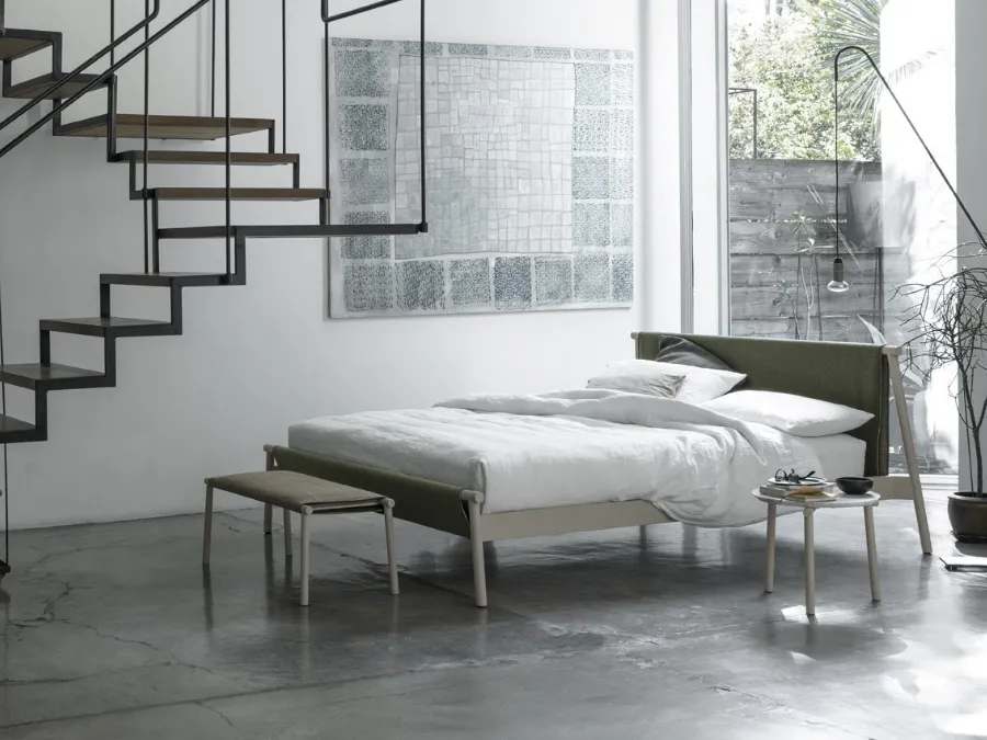 Bed with metal structure and fabric headboard Jack by Bolzan Letti.