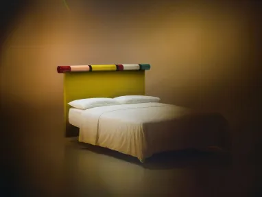 Rosary bed with fabric headboard and glossy lacquered finish by Bolzan Letti.