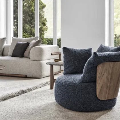 Calin armchair in upholstered fabric and Porada wood.