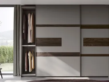 Wardrobe with sliding doors and Emotion TV stand by Fimar.