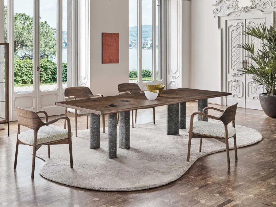 Osmosis table with walnut canaletto top and Porada marble base.